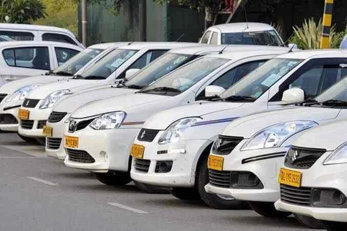White cars lined up for cab service